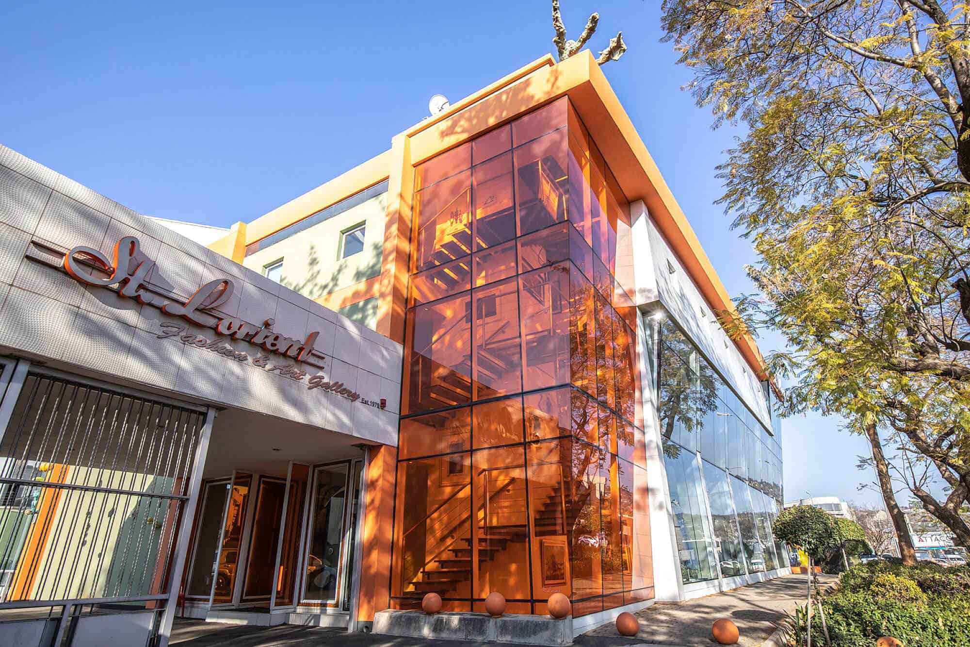 Modern building exterior with orange glass facade
